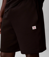 Pantaloni da tuta in spugna di cotone con stemma