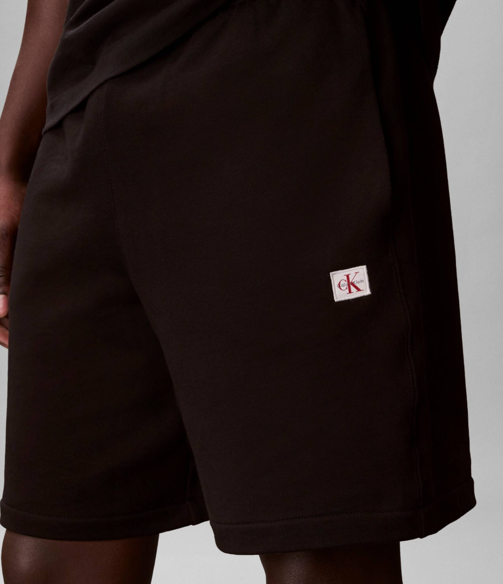 Pantaloni da tuta in spugna di cotone con stemma